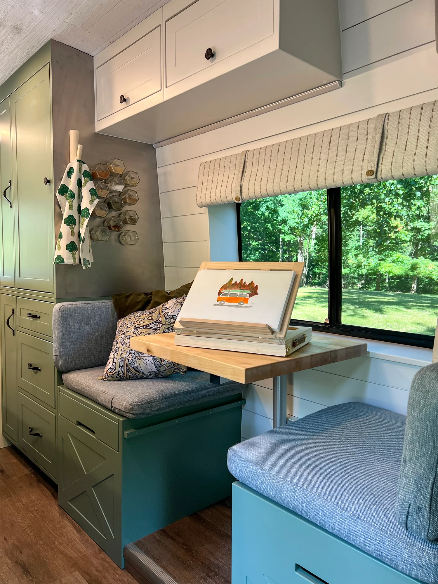 The Drifter 101 custom Ford Transit campervan built for Steph and Jen by Drifter Vans, Wanderer layout with a brick backsplash, sage green cabinetry, and farmhouse lighting