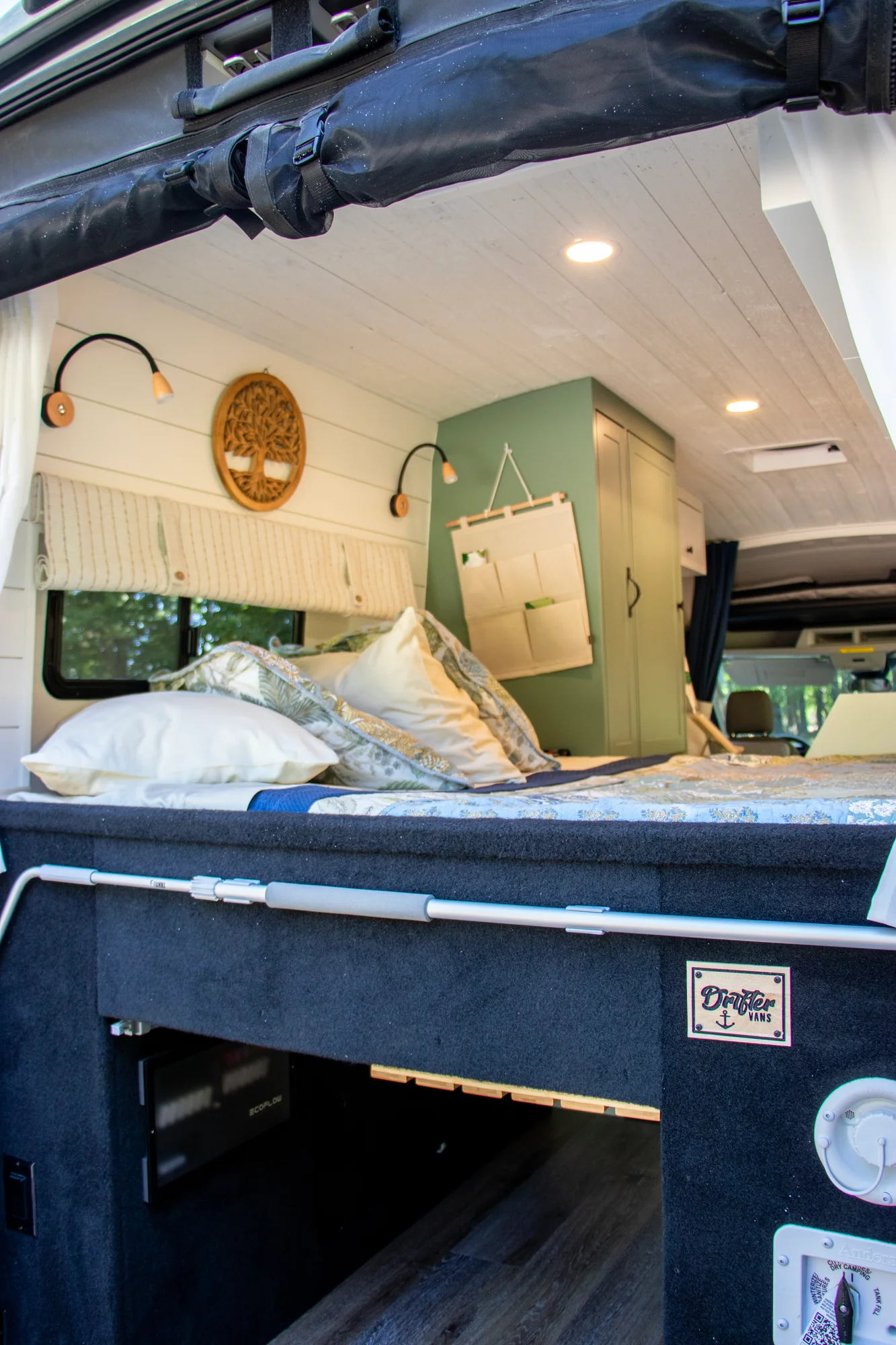 The Drifter 101 custom Ford Transit campervan built for Steph and Jen by Drifter Vans, Wanderer layout with a brick backsplash, sage green cabinetry, and farmhouse lighting
