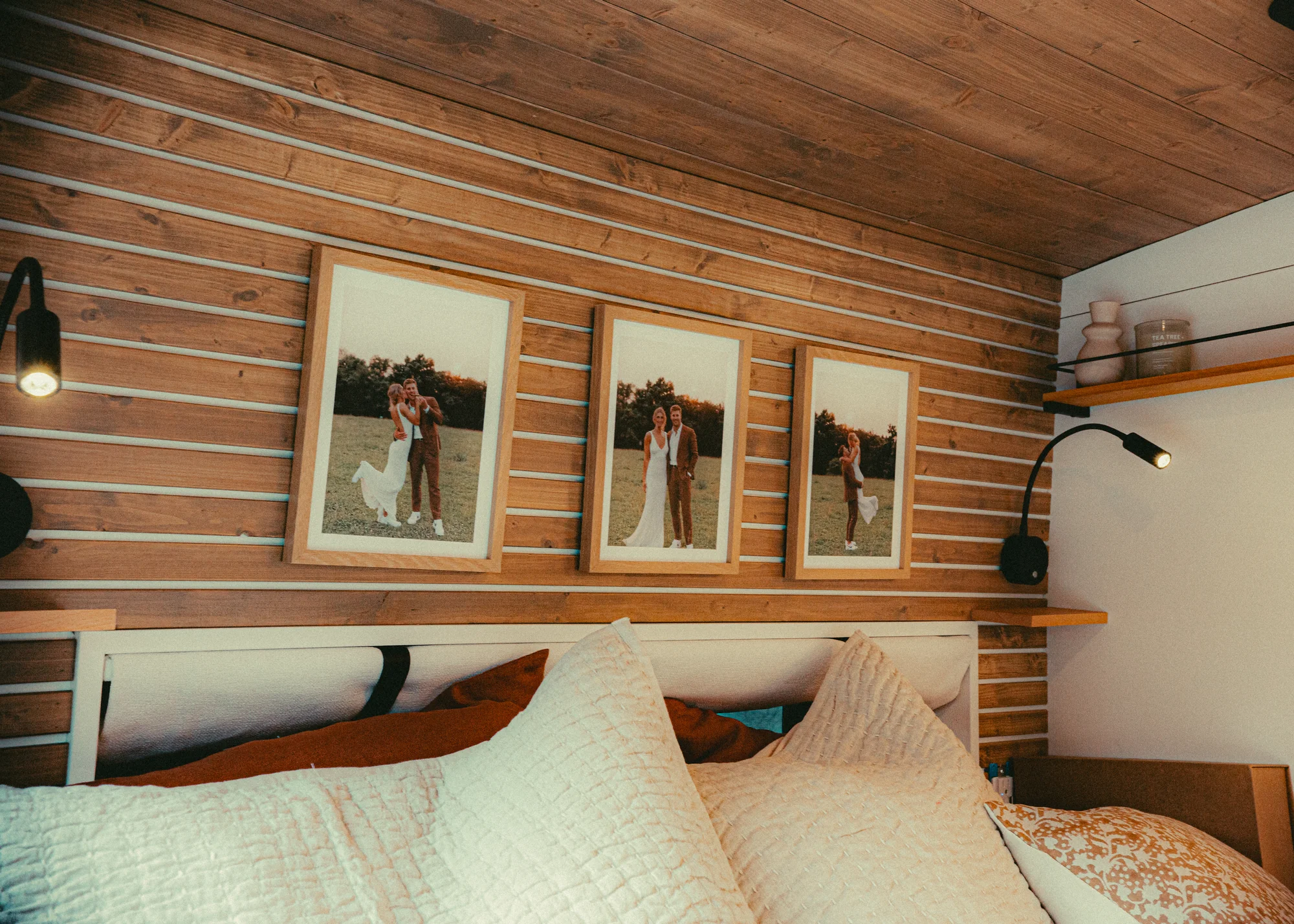 The Drifter 101 custom Ford Transit campervan built for Kyle and Zoe by Drifter Vans, Scout layout with white shiplap walls, light wood cabinetry, and a coastal-inspired interior