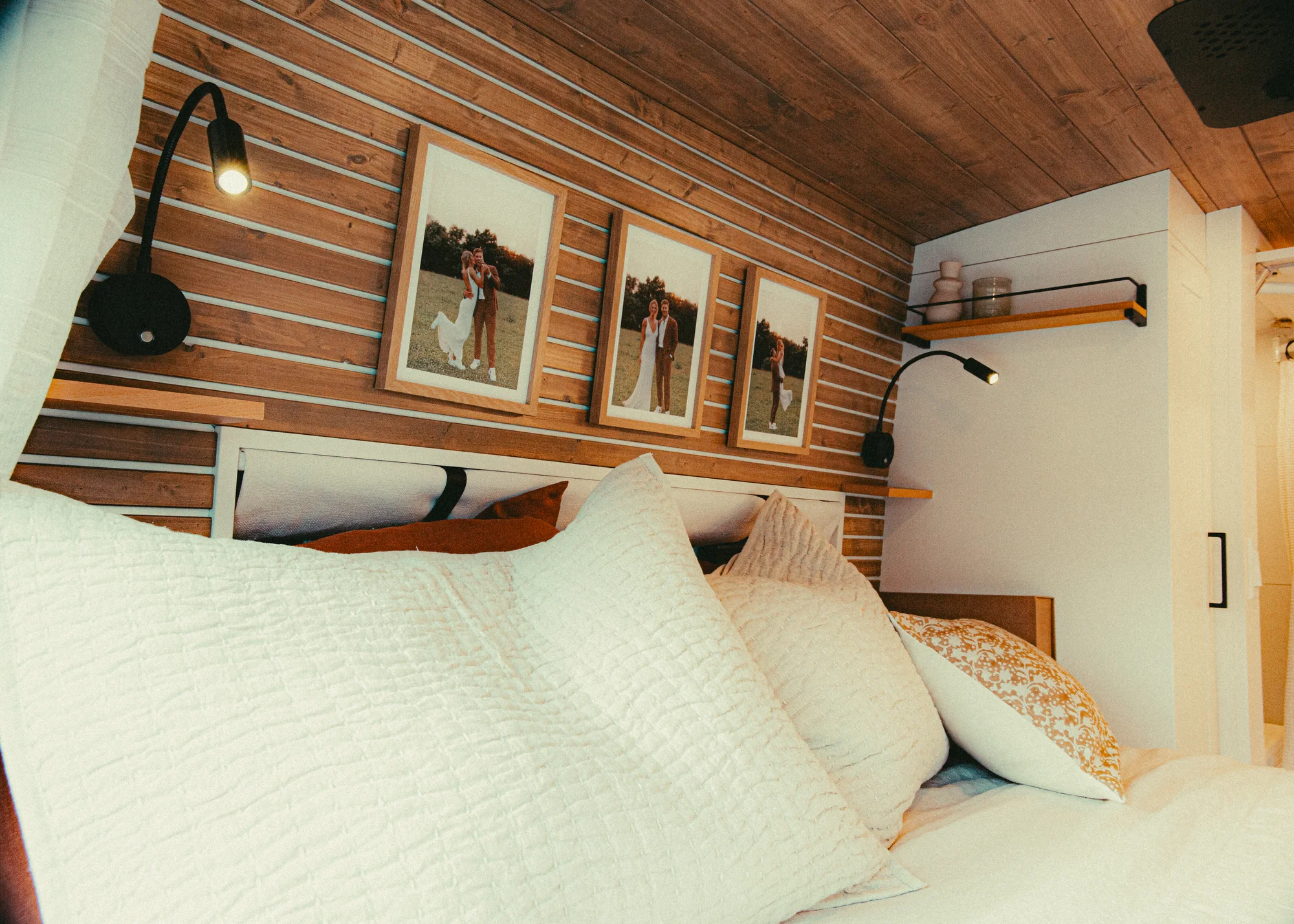 The Drifter 101 custom Ford Transit campervan built for Kyle and Zoe by Drifter Vans, Scout layout with white shiplap walls, light wood cabinetry, and a coastal-inspired interior