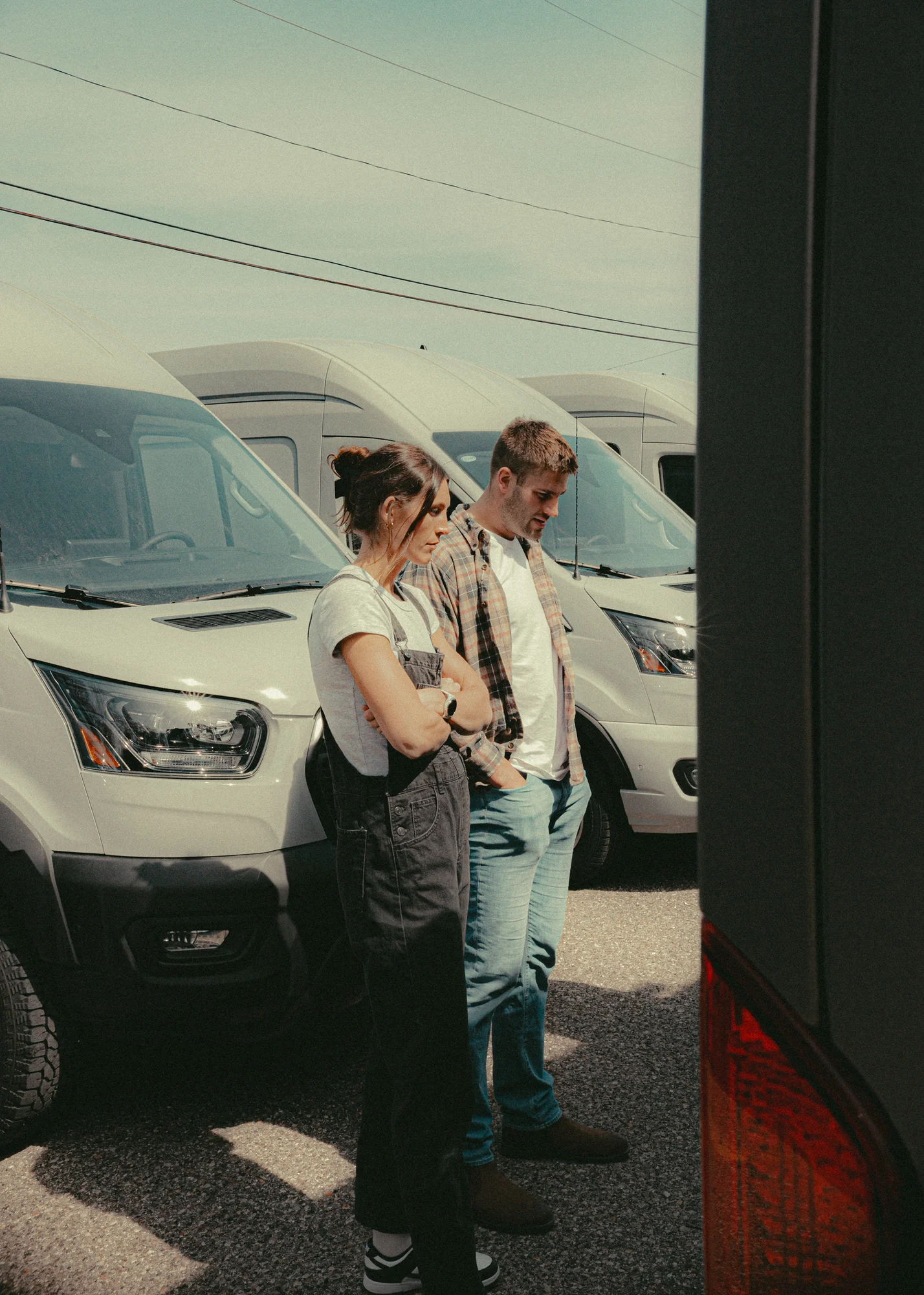 The Drifter 101 custom Ford Transit campervan built for Kyle and Zoe by Drifter Vans, Scout layout with white shiplap walls, light wood cabinetry, and a coastal-inspired interior