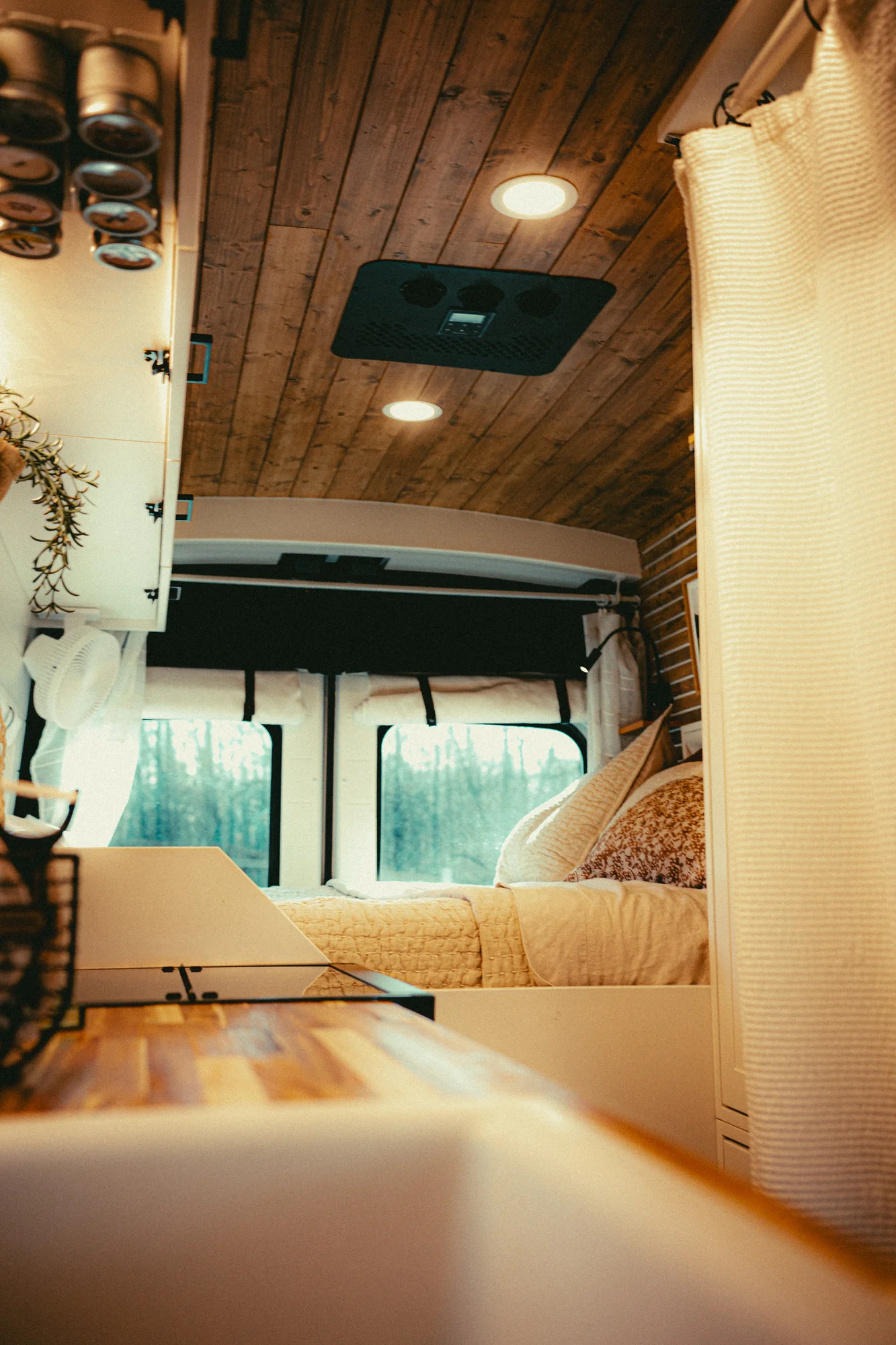 The Drifter 101 custom Ford Transit campervan built for Kyle and Zoe by Drifter Vans, Scout layout with white shiplap walls, light wood cabinetry, and a coastal-inspired interior