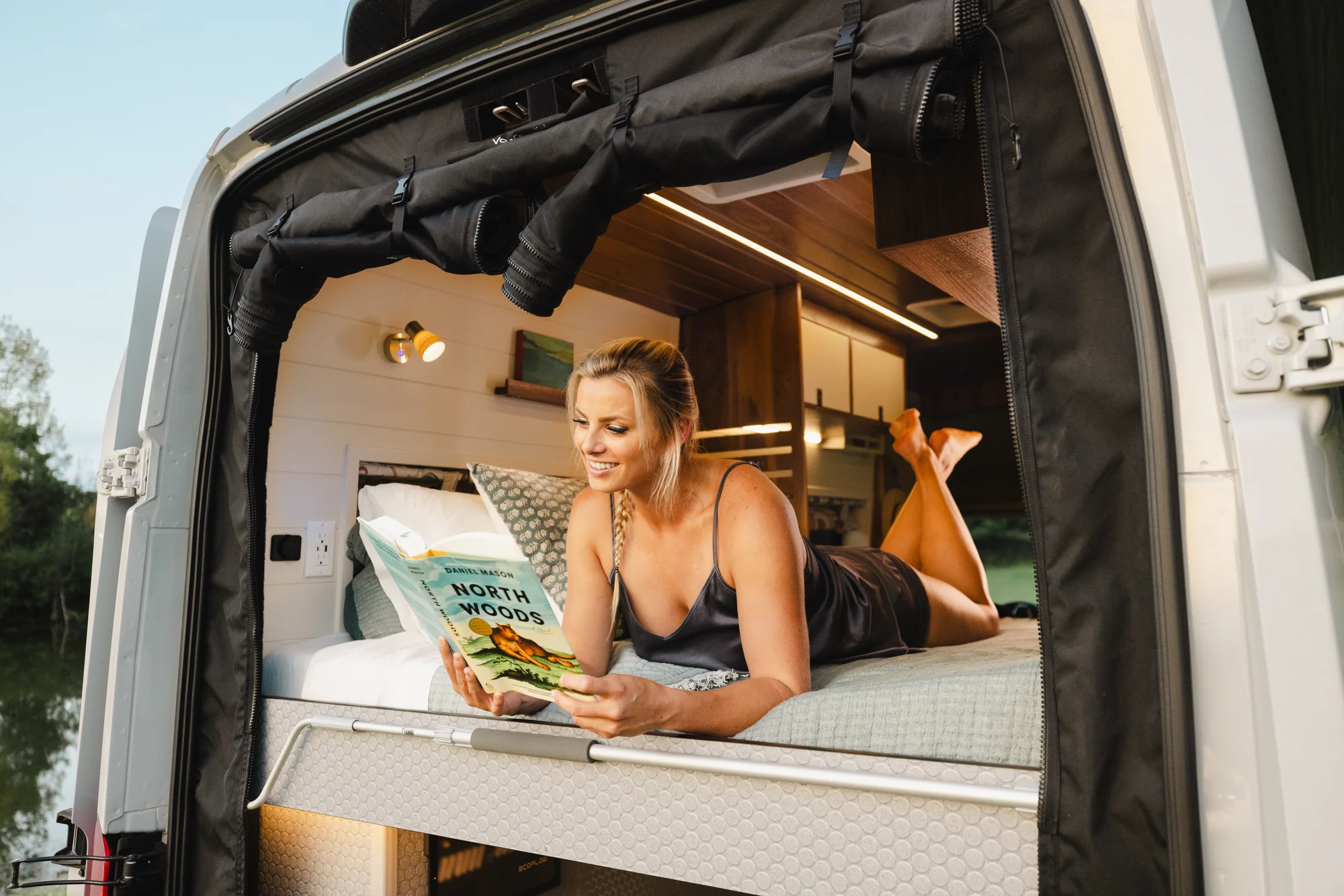 The Drifter 101 custom Ford Transit campervan built for Susan by Drifter Vans, Wanderer layout with modern nautical styling, mother of pearl tile, walnut cabinetry, and blue and white accents