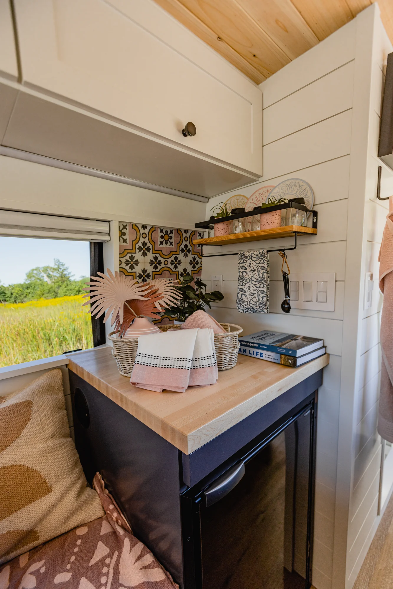 The Drifter 101 custom Mercedes-Benz Sprinter campervan built for Katie by Drifter Vans, with a pink boho interior, butcher block countertop, natural textures, and a full shower
