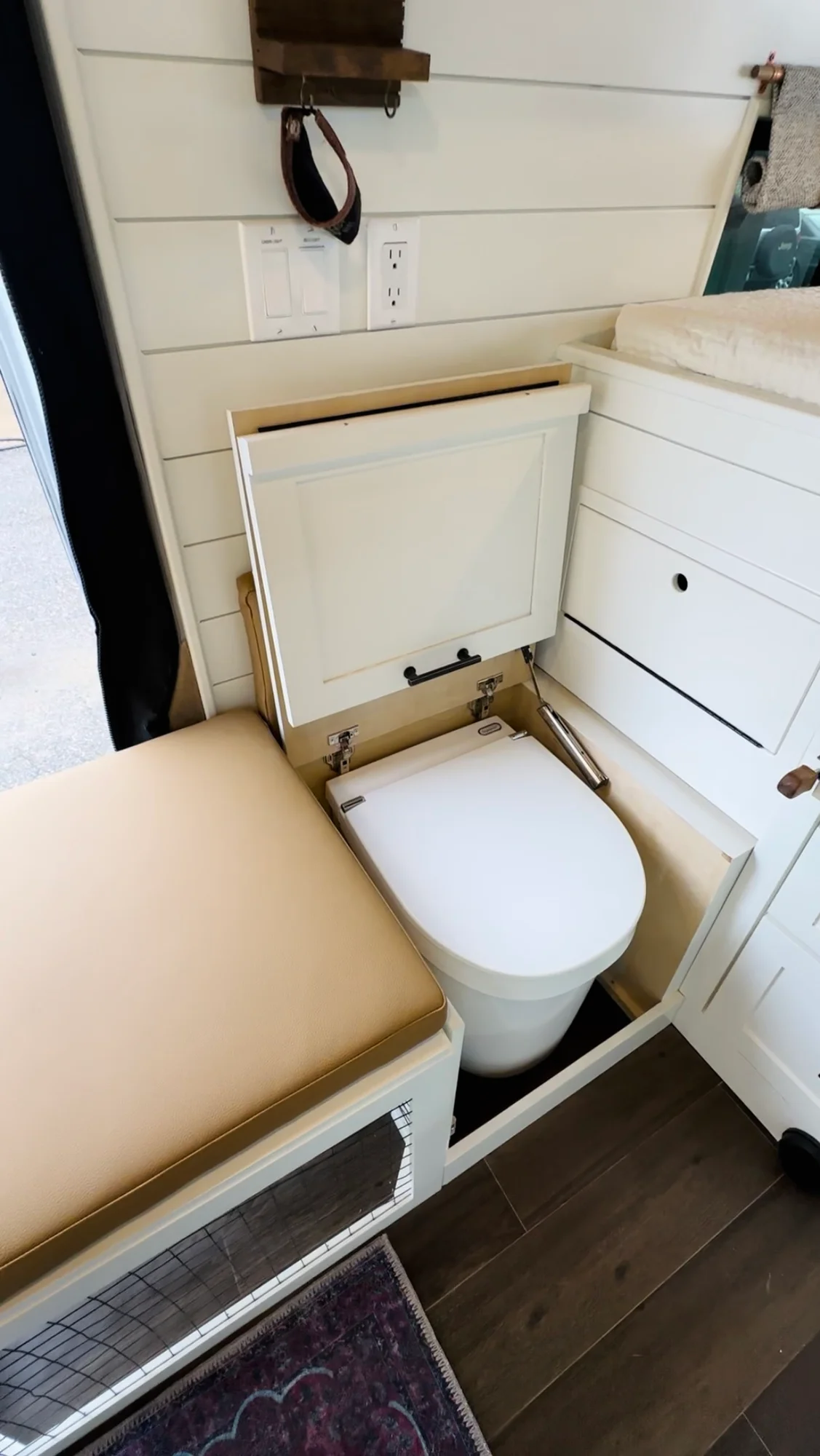The Drifter 101 custom Ford Transit campervan built for Valerie by Drifter Vans, with a rose boho interior, copper sink, earthy wood tones, and a built-in dog crate