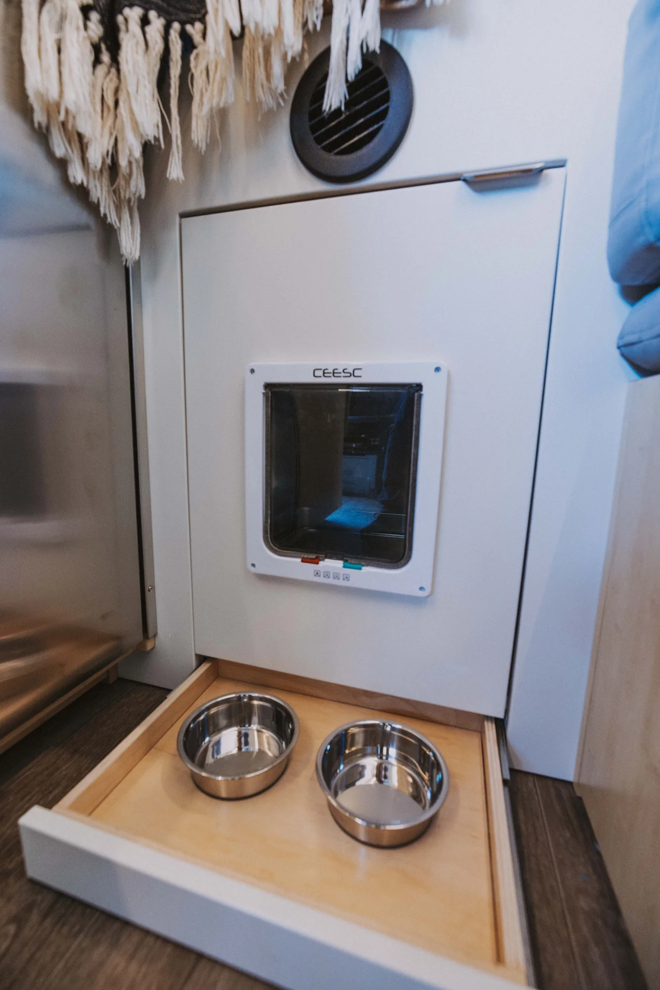The Drifter 101 custom Mercedes-Benz Sprinter campervan built for Rosa by Drifter Vans, with a natural bamboo interior, built-in dog bowls, and a full bed platform