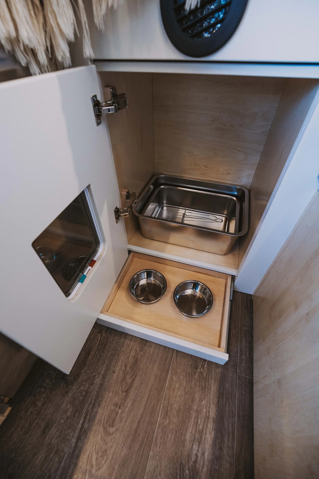 The Drifter 101 custom Mercedes-Benz Sprinter campervan built for Rosa by Drifter Vans, with a natural bamboo interior, built-in dog bowls, and a full bed platform