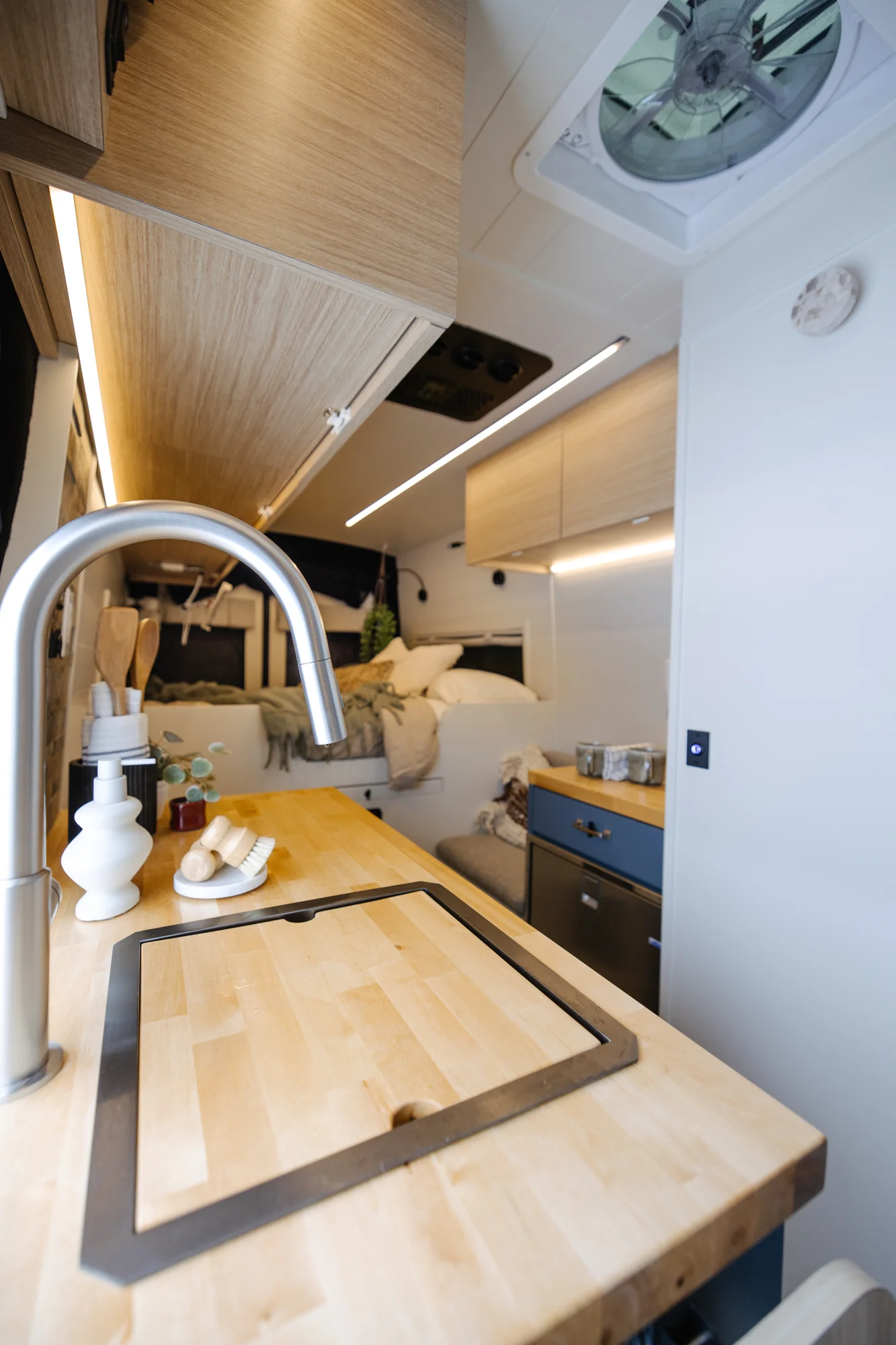 The Drifter 101 custom Ford Transit campervan built for Dan and Karen by Drifter Vans, Nomadik layout with an Indian autumn stone wet bath, trifold door, Aluminus bumper, and FVCO roof rack