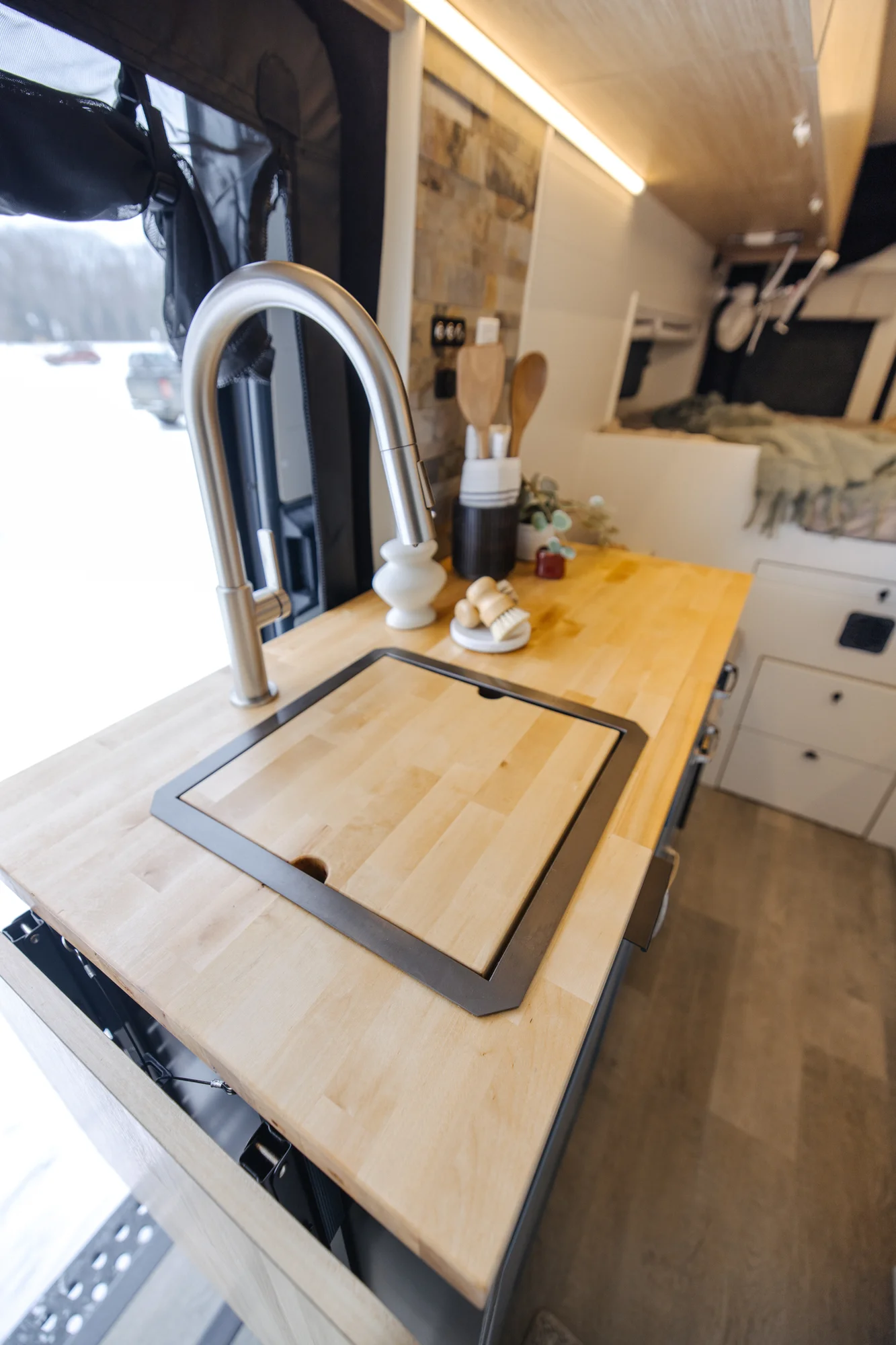 The Drifter 101 custom Ford Transit campervan built for Dan and Karen by Drifter Vans, Nomadik layout with an Indian autumn stone wet bath, trifold door, Aluminus bumper, and FVCO roof rack