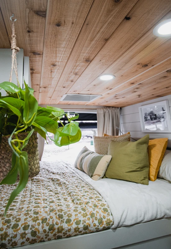 Interior of a green drifter camper vans bed area