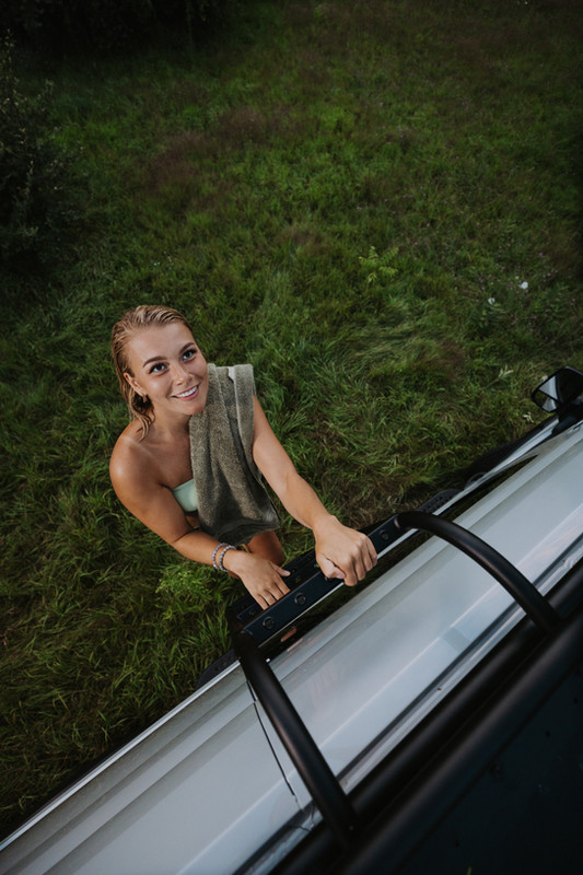 woman in bathing suit climbing up an FVCO ladder