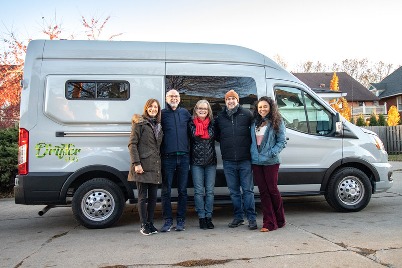 Clients Kevin and Belinda standing in front of their new Drifter Van with Paul Domish and interior designer Kathleen at delivery.