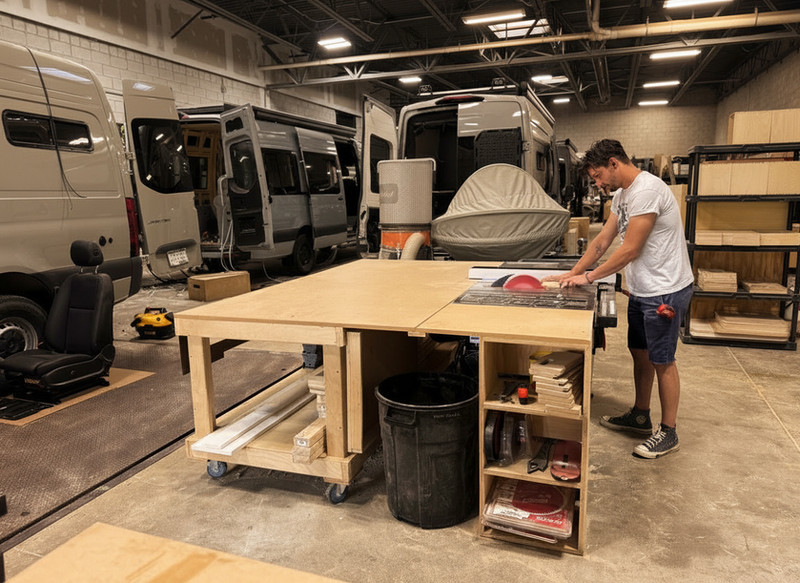 Craftsman fitting custom cabinetry in a Drifter campervan