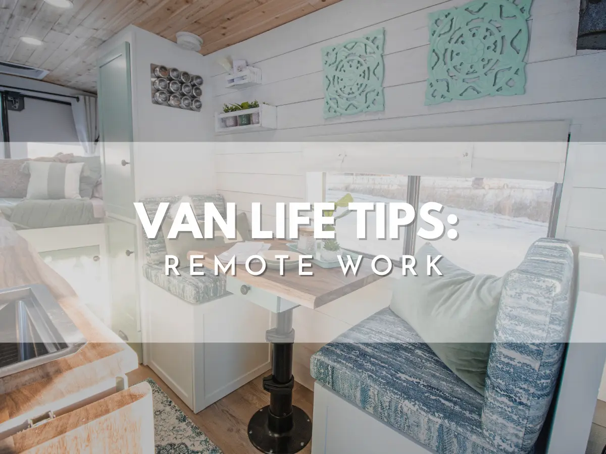 Van life tips cover: remote work guide for campervans, dinette workspace with pedestal table and blue upholstered benches in a bright coastal-style van interior