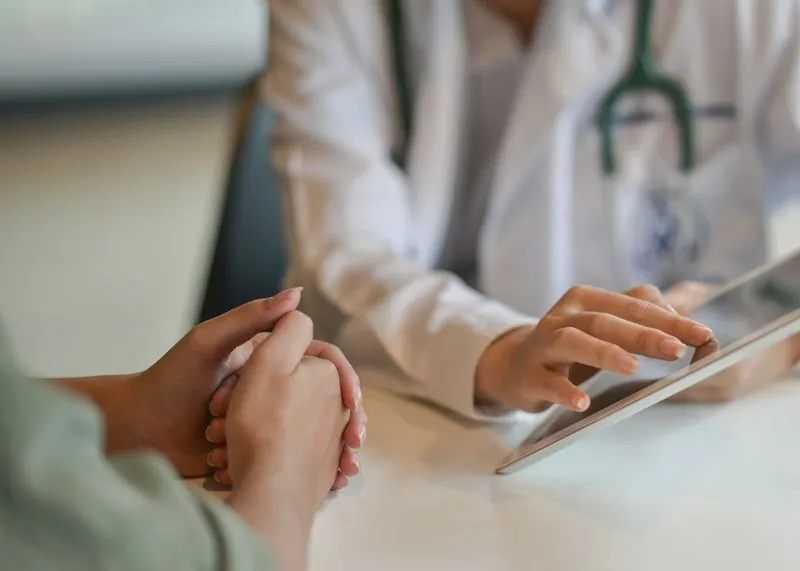A doctor talking to a patient