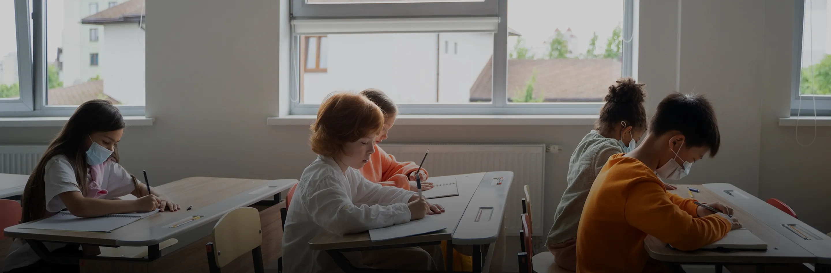 Students working independently at their desks in a classroom