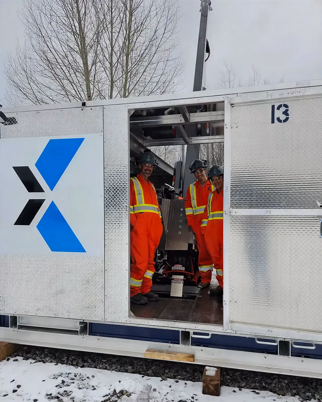 Corexplore crew working inside a heated core shack at a winter drill site