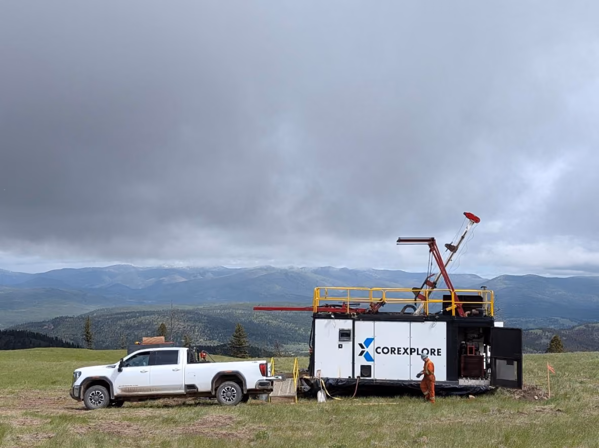 Corexplore truck and drill rig on a ridge at the Columbia Gold and Silver Project near Lincoln, Montana
