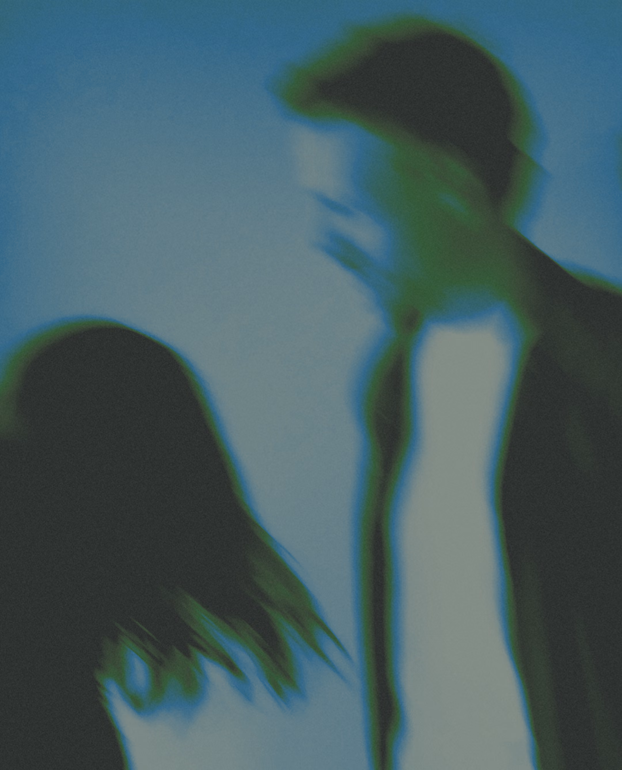 A blurred image of Matt and Missy
