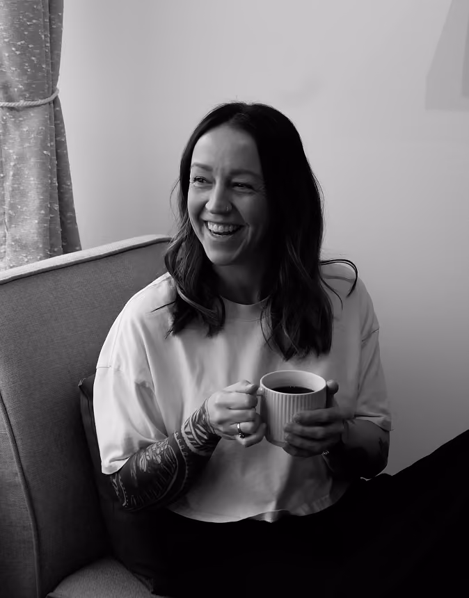 Missy from Greaterthan Studio with a coffee