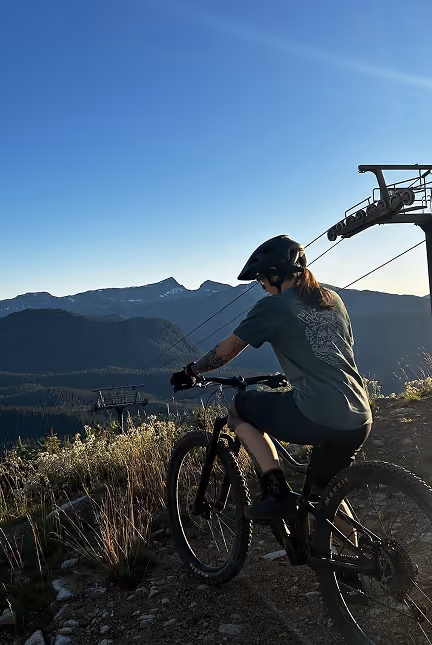 Missy from Greaterthan Studio mountain biking on a Vancouver Island trail