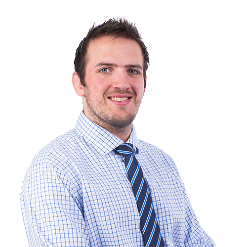 Smiling man in a checkered shirt and striped blue tie on a white background.