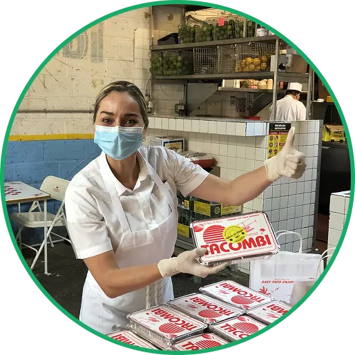 tacombi woman preparing catering order
