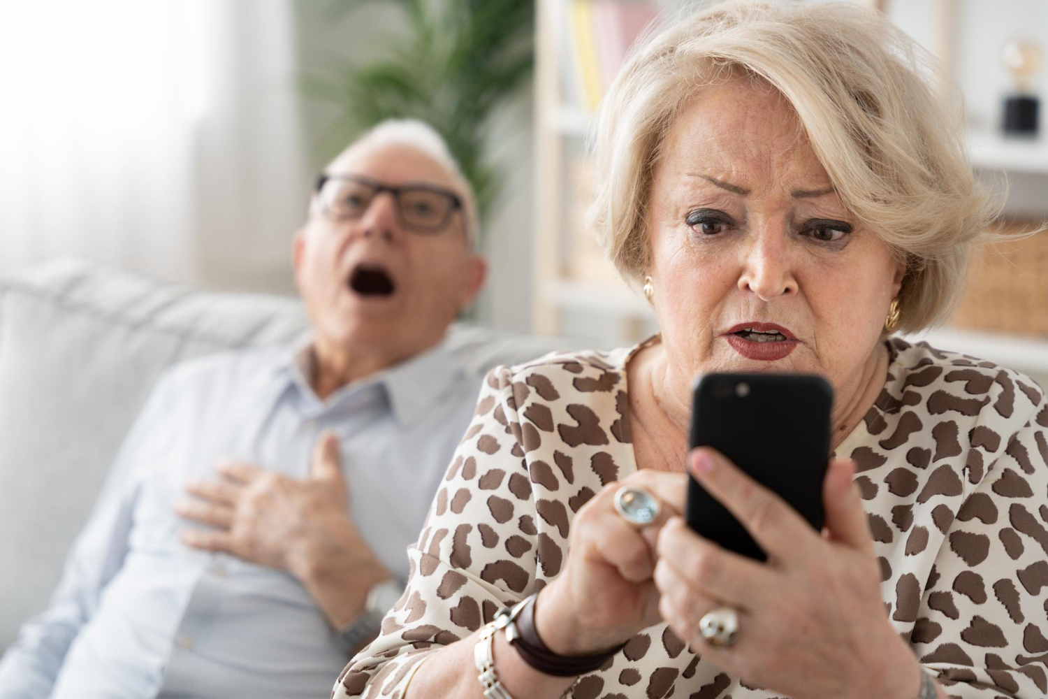Woman snooping in man's phone