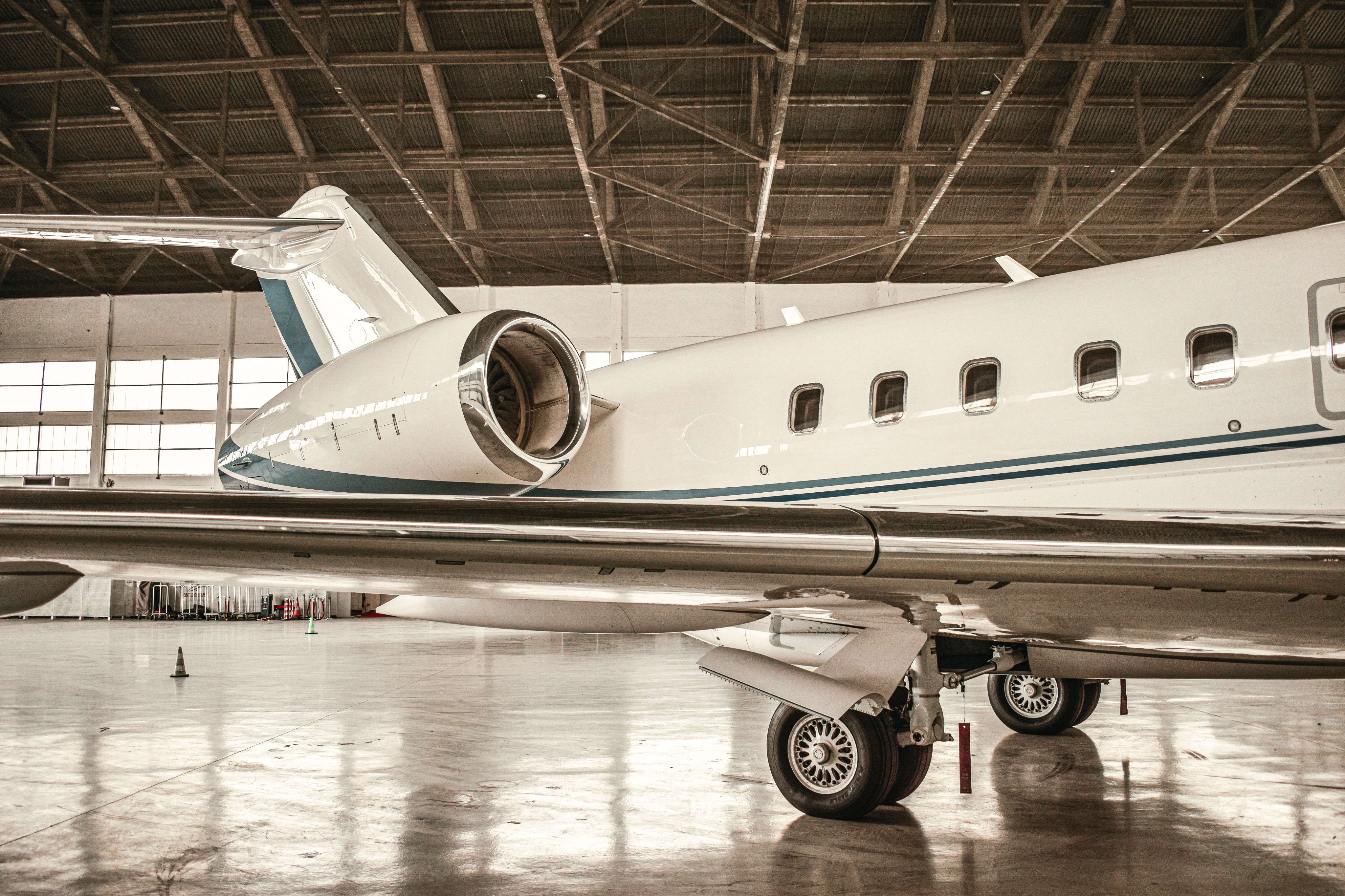 Private jet parked inside a hangar