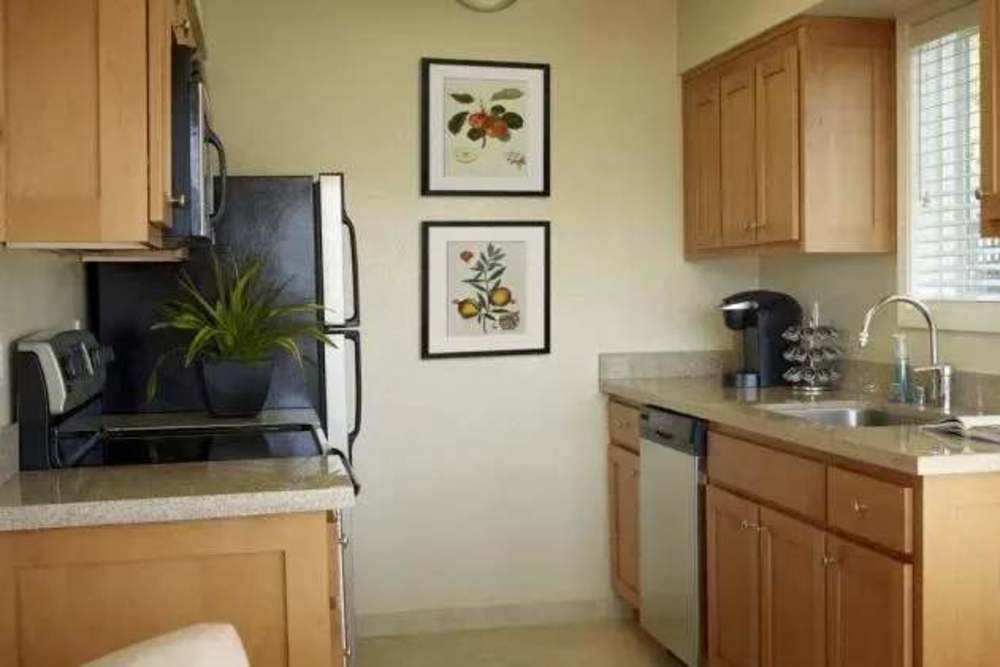 Kitchen with brown cabinets and stainless steel appliances