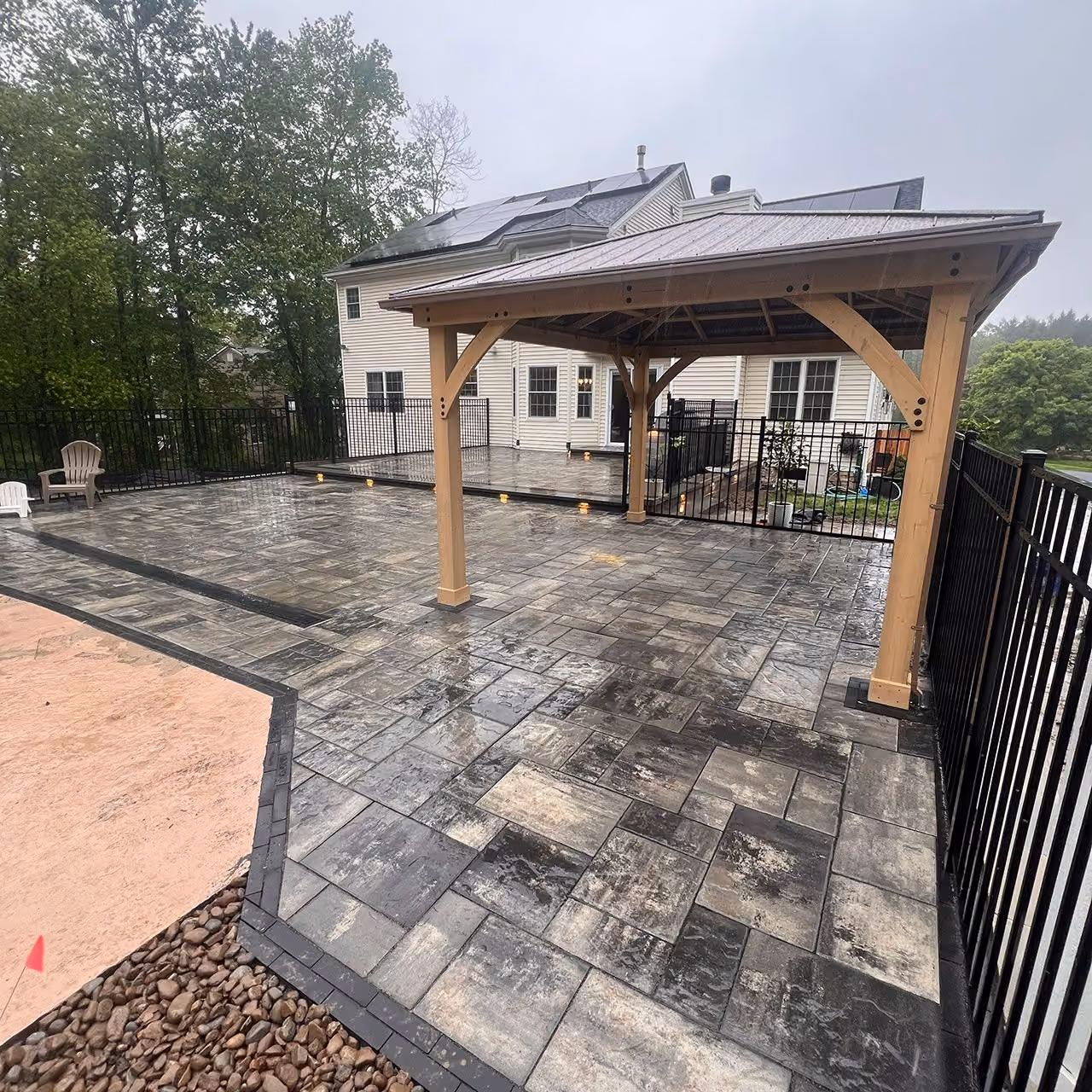 Outdoor living installation near me with patios, retaining walls, and stone features by A and G Landscape Design and Excavation
