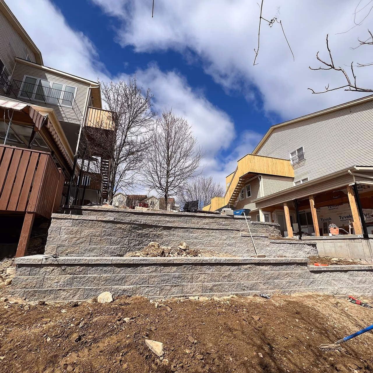 Decorative stone retaining wall by A and G Landscape Design and Excavation