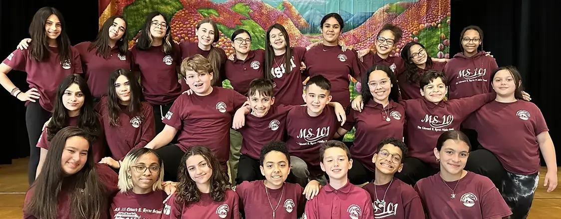 MS 101 students posing together in maroon school shirts