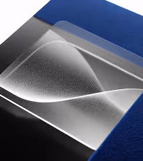 A transparent rectangular sheet with white wave-like patterns on a blue and black background.