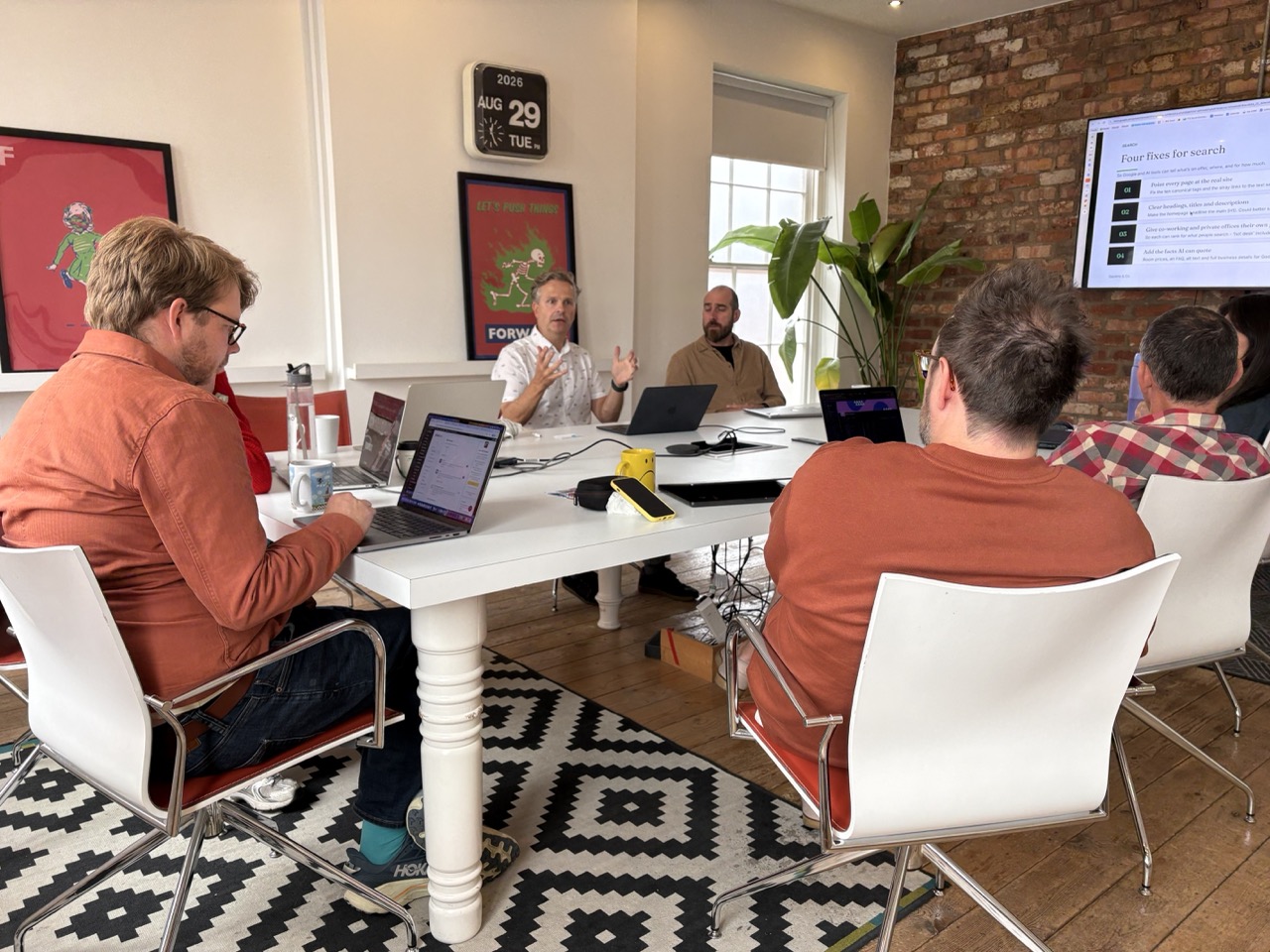 Anthony Tattum running a workshop around a meeting table