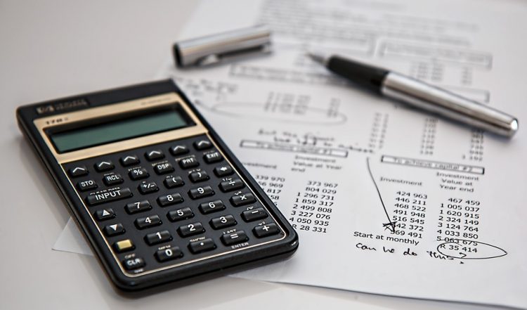Image of a calculator and random financial statements