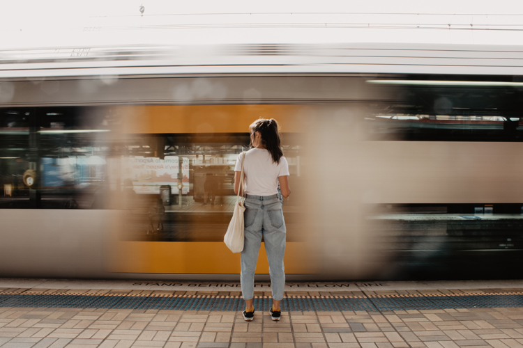 Image of a girl standing on a platform of a Sydney train station | Spotlight on Sydney article