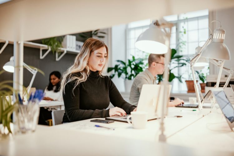 People working in an office to illustrate a subleased or assigned office space