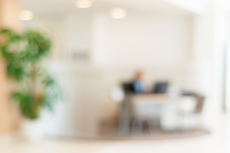 blurred image of office to signify what to do before signing a lease