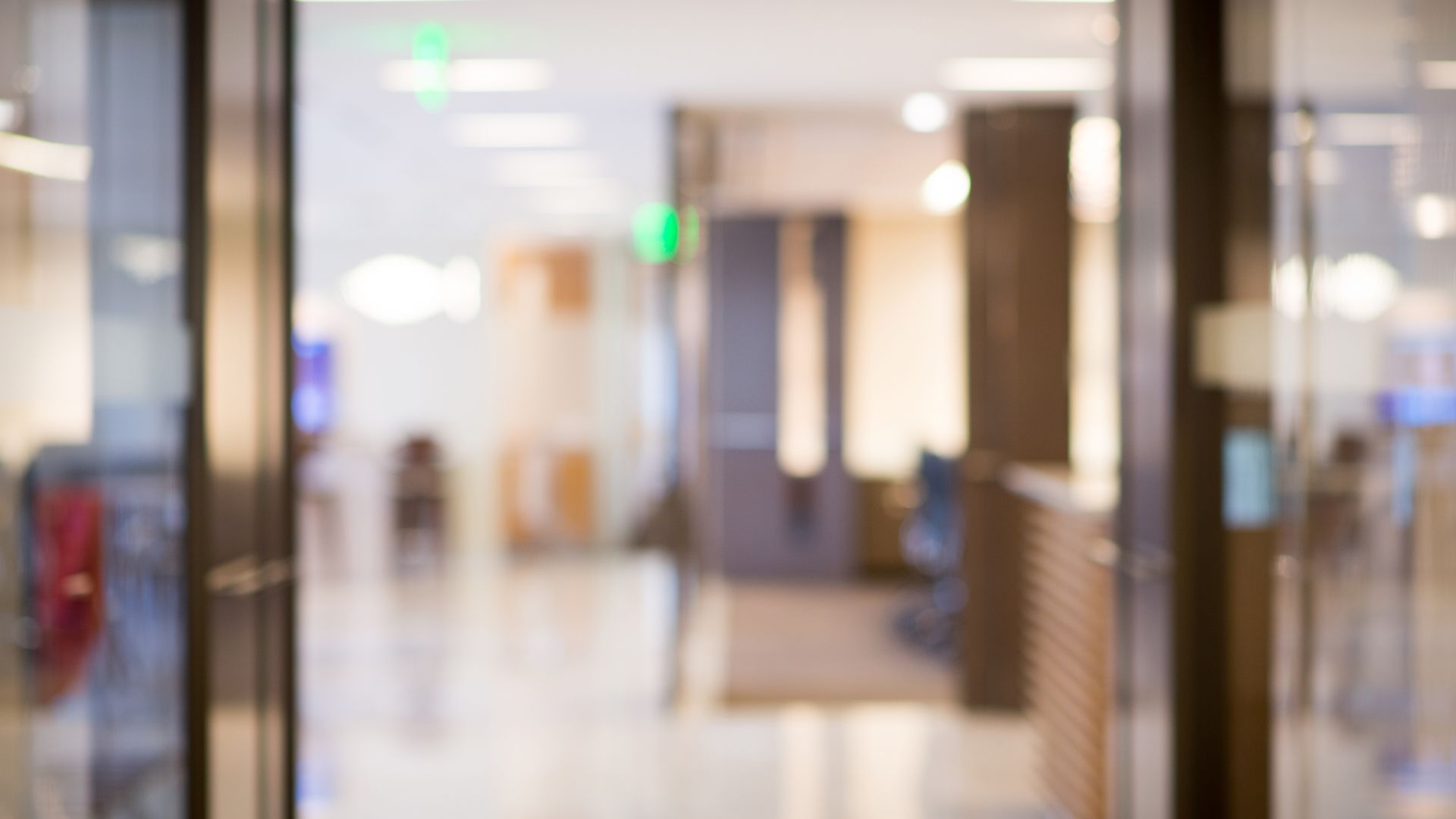 Blurred image showcasing a modern commercial office space, symbolizing the professional environment and services offered for tenant representation. 