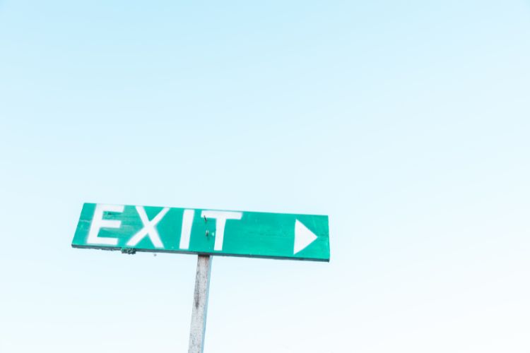 sign that says "exit" to illustrate lease exit considerations when working through commercial leasing checklist