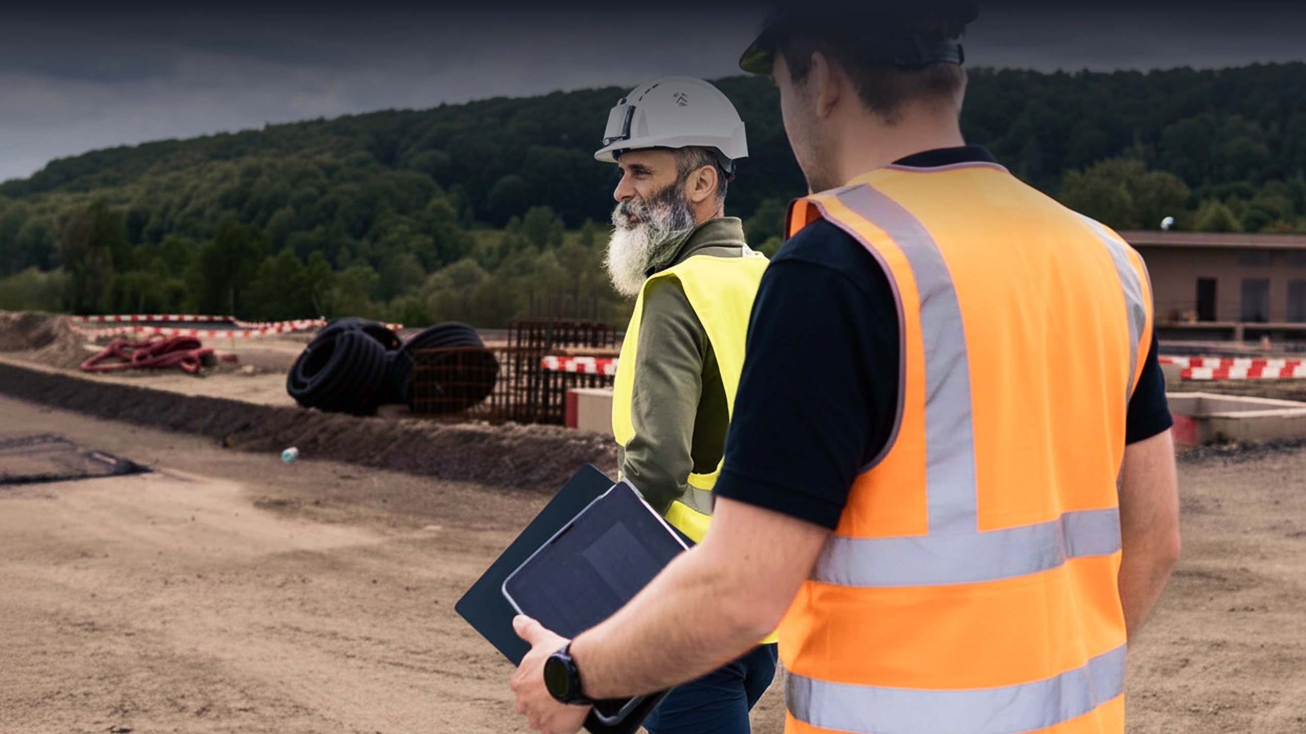 CONBENE advisor visiting a constructions site inspecting the site with the client.