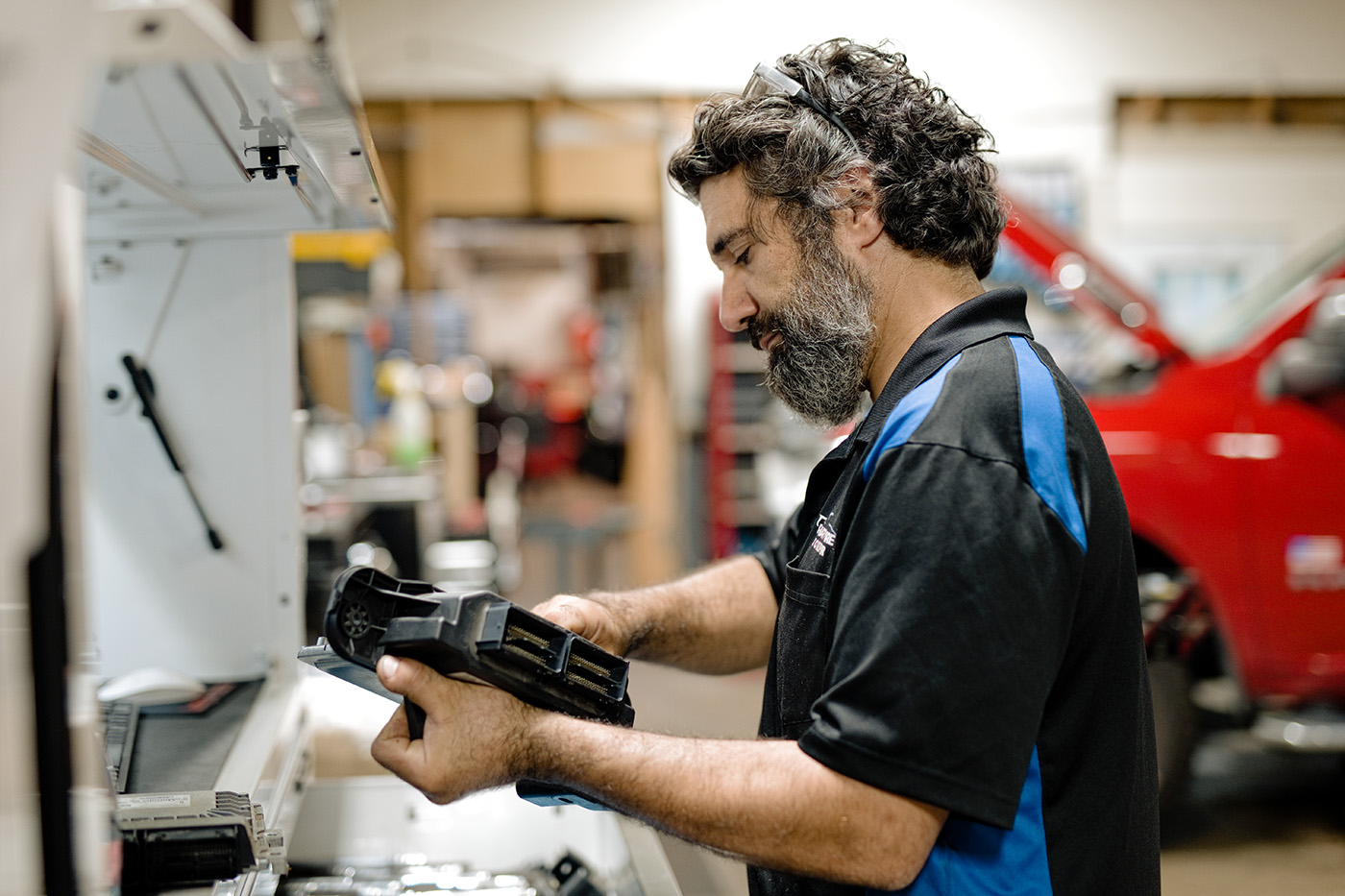 ASE-certified technician performing advanced engine diagnostics using professional scan tools at Primary Care Auto Repair.