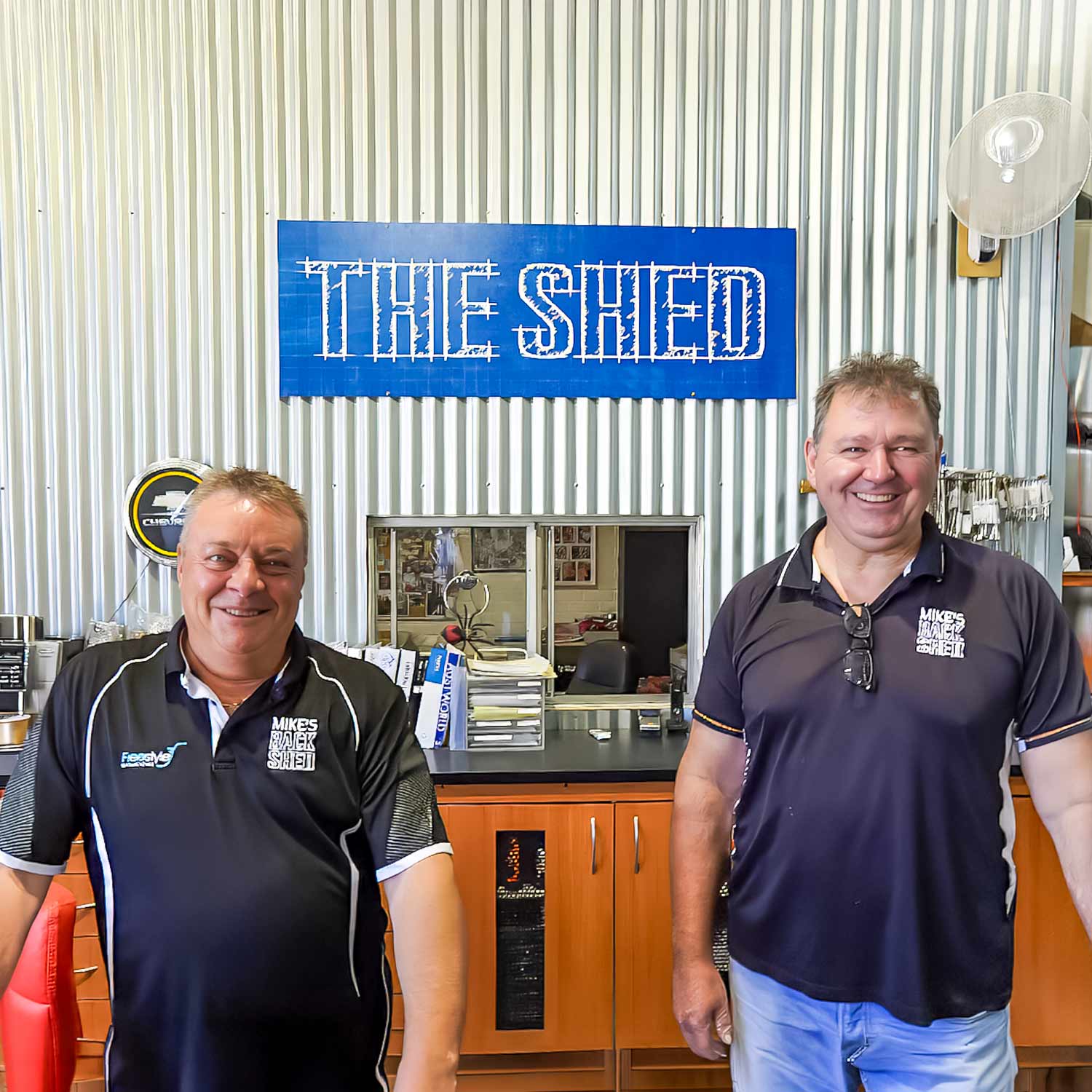 Two Mike's Back Shed team members at the Osborne Park warehouse counter.