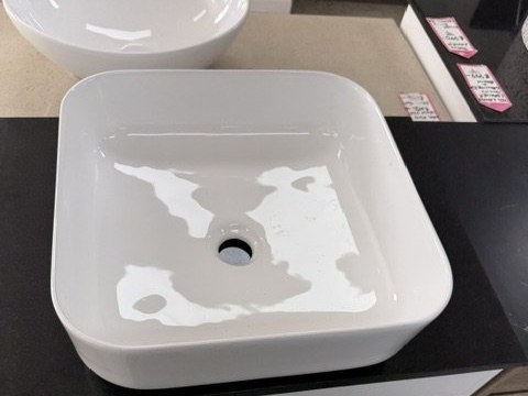 White high-gloss vitreous china countertop basin, 385 mm square, on a vanity at Mike's Back Shed.