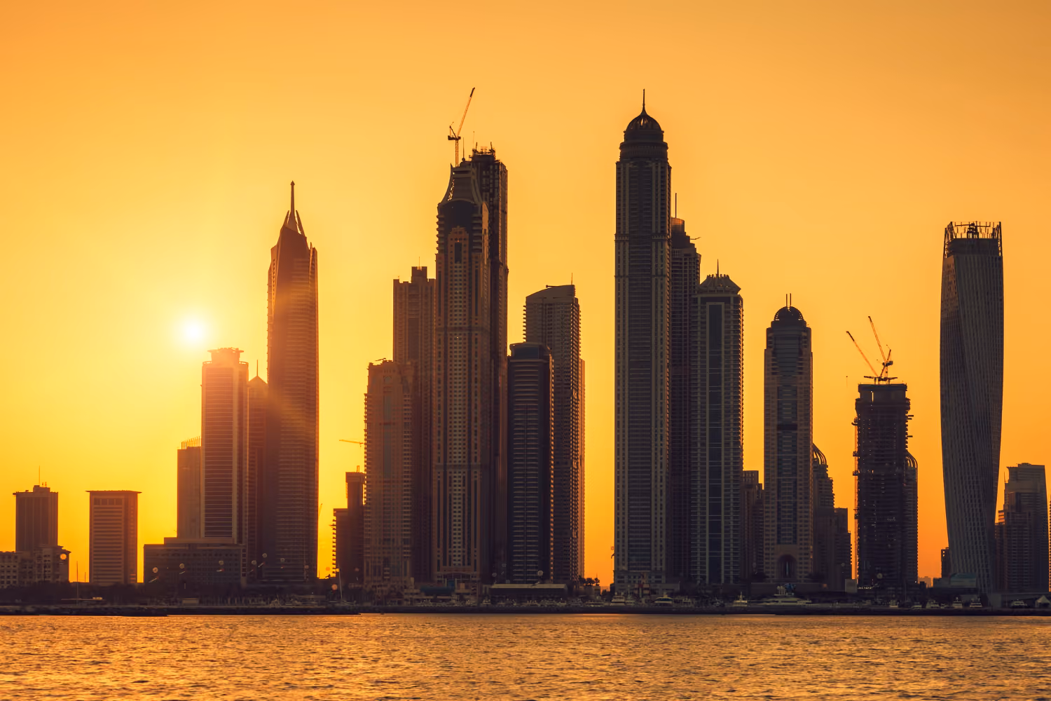 Dubai cityscape representing housing, transport, healthcare, education, and everyday living costs