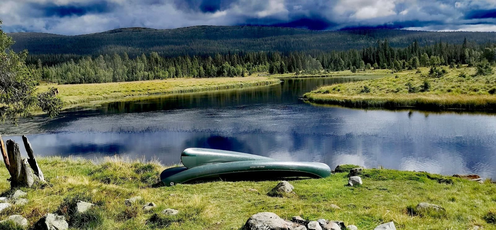 A canoe resting by the river