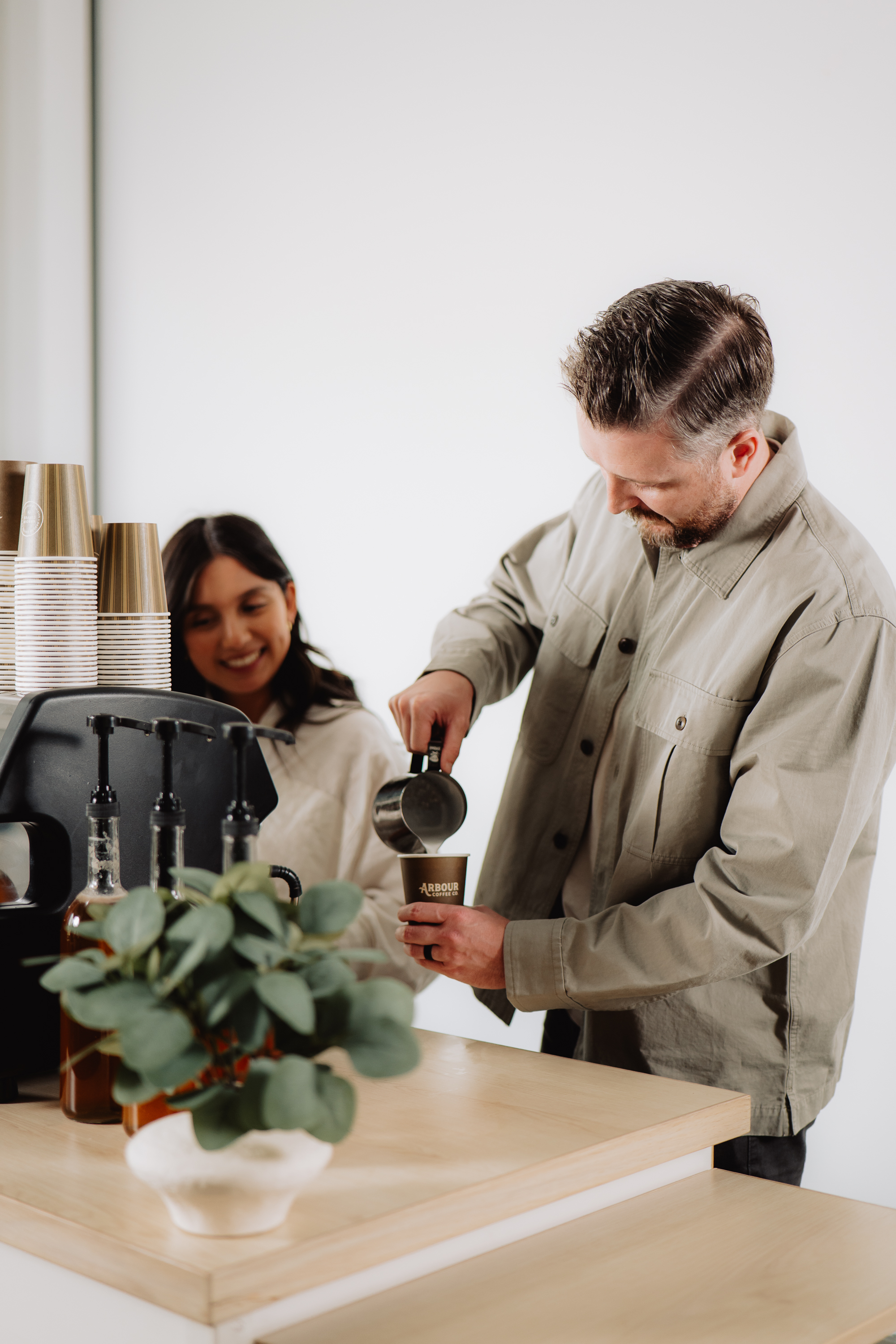 Barista preparing handcrafted drinks at a corporate coffee service