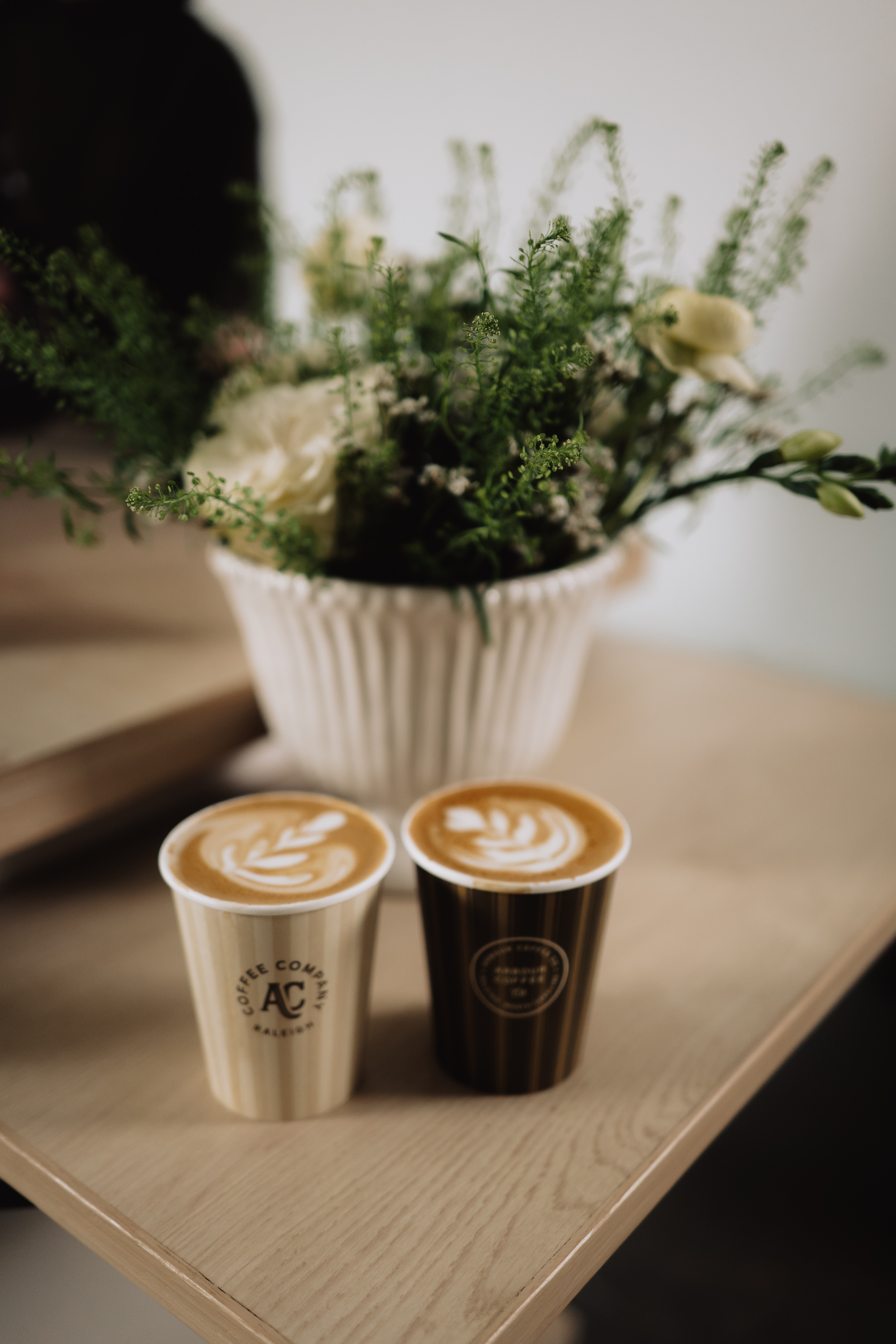 Two Arbour lattes with florals at a Raleigh wedding