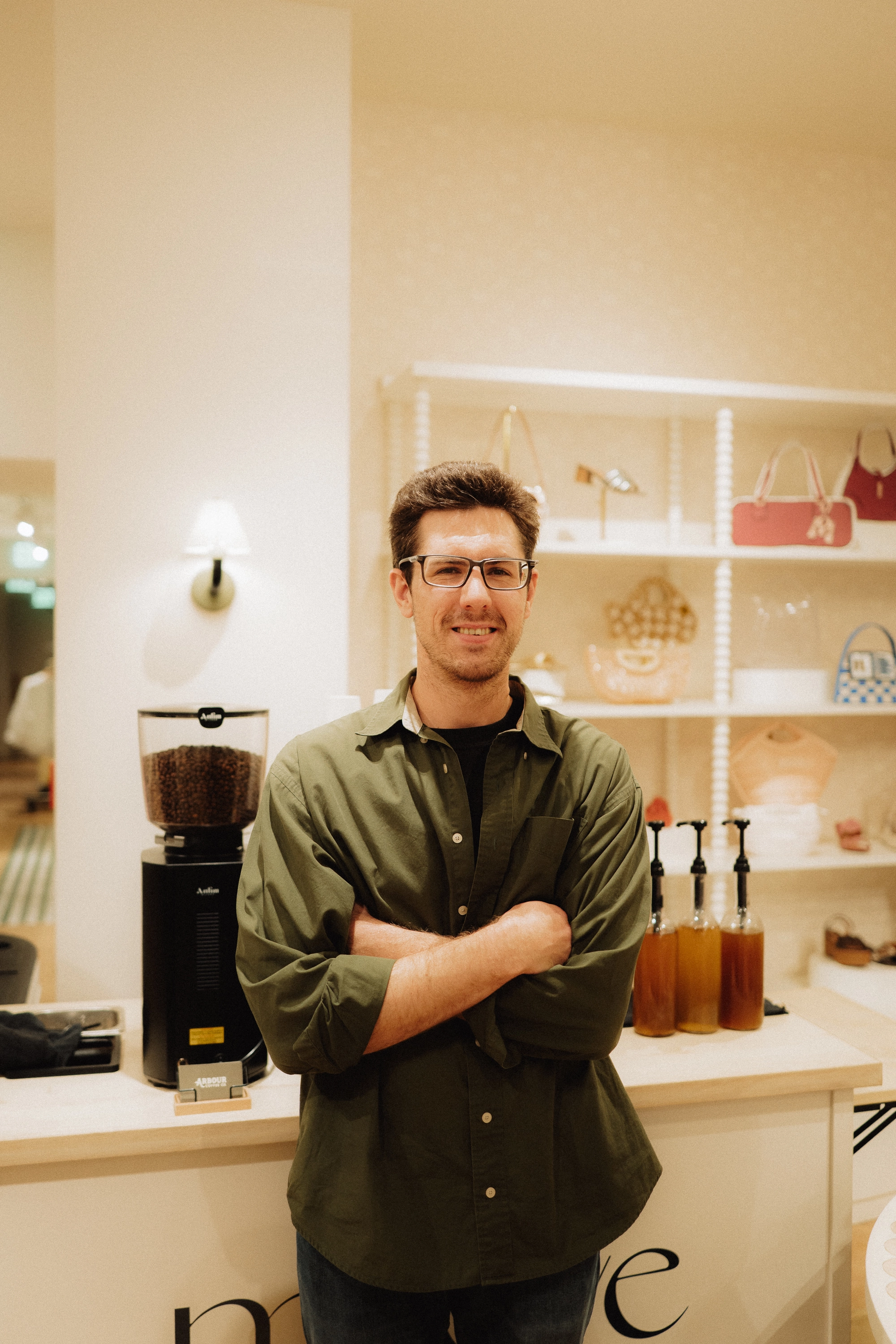 Arbour barista behind the coffee bar at the Maeve boutique